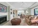 Open-concept living room with abundant natural light and views into the dining area at 4901 Green Dolphin Way, Kiawah Island, SC 29455