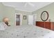 Spacious bedroom with ceiling fan, hardwood floors, and a dresser at 4901 Green Dolphin Way, Kiawah Island, SC 29455