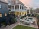 Tranquil backyard with a relaxing pool, cozy seating area, and lush greenery for serene outdoor living at 5 Alexander St, Charleston, SC 29401