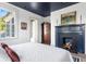 Charming bedroom with a fireplace, tall ceilings, and lots of natural light at 5 Alexander St, Charleston, SC 29401