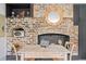 Dining room features a brick fireplace, vintage table, and decorative accents at 5 Alexander St, Charleston, SC 29401