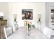 Bright dining room featuring a rustic table, elegant chairs and views of a painting on the wall at 5 Alexander St, Charleston, SC 29401