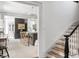 Open-concept interior showcasing a modern kitchen, staircase, and seamless flow for entertaining and Gathering living at 5 Alexander St, Charleston, SC 29401