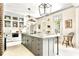Bright and airy kitchen with a spacious island, stainless steel appliances, and custom cabinetry for culinary enthusiasts at 5 Alexander St, Charleston, SC 29401