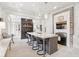 Elegant kitchen with a large island, modern appliances, stylish pendant lighting, and ample cabinet space at 5 Alexander St, Charleston, SC 29401