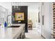 Close-up of a kitchen island with a marble countertop, stylish fixtures, and high-end appliances at 5 Alexander St, Charleston, SC 29401