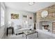 Cozy living room with white sofa, decorative pillows, fireplace, and stylish decor at 5 Alexander St, Charleston, SC 29401