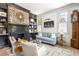 Comfortable living room with brick fireplace, hardwood floors, and a cozy seating area at 5 Alexander St, Charleston, SC 29401