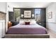 Elegant main bedroom with hardwood floors, natural light, and sophisticated decor at 5 Alexander St, Charleston, SC 29401
