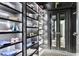 Well-organized walk-in closet with custom shelving and mirrored doors leading into the bedroom at 5 Alexander St, Charleston, SC 29401