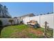 Backyard with art installation and privacy fence at 509 Nadir Ct, Summerville, SC 29486