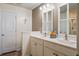 Bathroom with double vanity sinks, white cabinetry, and a decorative mirror at 509 Nadir Ct, Summerville, SC 29486