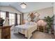 A bedroom featuring a decorative headboard wall, dresser, and a window at 509 Nadir Ct, Summerville, SC 29486
