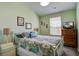 Bedroom with a paisley comforter, decorative pillows, and window at 509 Nadir Ct, Summerville, SC 29486