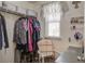 A closet with shelving and hanging clothes, and a small window at 509 Nadir Ct, Summerville, SC 29486