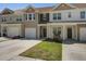 Attractive townhouses with individual driveways, covered entrances, and well-maintained front lawns at 509 Nadir Ct, Summerville, SC 29486