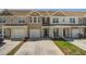 Charming townhome with two-car garage, neutral siding, manicured lawn, and concrete driveway at 509 Nadir Ct, Summerville, SC 29486