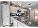 A kitchen with white cabinets, granite countertops, and stainless steel appliances at 509 Nadir Ct, Summerville, SC 29486