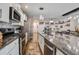 Open kitchen featuring stainless steel appliances, granite countertops, and a breakfast bar at 509 Nadir Ct, Summerville, SC 29486