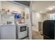 Laundry room with white washer and dryer, wire shelving, and access to the hallway at 509 Nadir Ct, Summerville, SC 29486
