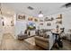 Comfortable living room with couch, television, decorative shelving, and stylish decor at 509 Nadir Ct, Summerville, SC 29486