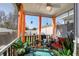 Inviting screened porch with comfortable seating, ceiling fan, and peaceful backyard views at 509 Nadir Ct, Summerville, SC 29486