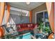Cozy screened porch featuring stylish furniture, vibrant plants, and a relaxing atmosphere at 509 Nadir Ct, Summerville, SC 29486