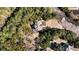 Aerial view of a wooded property showcasing the house and surrounding lush greenery at 6021 Jibe Ct, Awendaw, SC 29429