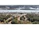 Expansive aerial shot showcasing waterfront homes with private docks along a marshy river inlet at 6021 Jibe Ct, Awendaw, SC 29429