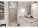 Modern bathroom with walk-in shower, glass door, neutral color scheme, and updated vanity at 6021 Jibe Ct, Awendaw, SC 29429