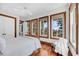 Bedroom with hardwood floors, natural light and balcony view at 6021 Jibe Ct, Awendaw, SC 29429