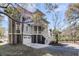 Inviting coastal home with a two-car garage, elevated porch, and beautiful landscaping at 6021 Jibe Ct, Awendaw, SC 29429