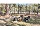 Outdoor fire pit area with chairs, perfect for cozy evenings in a natural wooded setting at 6021 Jibe Ct, Awendaw, SC 29429