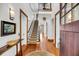 Spacious foyer with wooden floors, a staircase, and views of the upper level at 6021 Jibe Ct, Awendaw, SC 29429