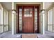 Inviting front door with sidelights, decorative lanterns, and an attractive entrance at 6021 Jibe Ct, Awendaw, SC 29429