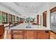A kitchen island overlooks the open dining room, living room and beyond, connecting the home at 6021 Jibe Ct, Awendaw, SC 29429