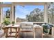 Grill area on covered porch with views of trees and water at 6021 Jibe Ct, Awendaw, SC 29429