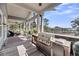 Spacious, covered porch featuring outdoor grill and scenic views at 6021 Jibe Ct, Awendaw, SC 29429