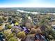 Broad aerial perspective capturing a home within a picturesque neighborhood featuring ponds, lush trees, and winding roads at 669 Palisades Dr, Mount Pleasant, SC 29464