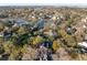 Expansive aerial view of a home amid a vibrant community with waterways, trees, and a distant cityscape at 669 Palisades Dr, Mount Pleasant, SC 29464