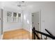 Bright room featuring hardwood floors and a window with plantation shutters at 669 Palisades Dr, Mount Pleasant, SC 29464
