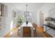 Bright dining room with stylish lighting, plantation shutters, hardwood floors, and contemporary furnishings at 669 Palisades Dr, Mount Pleasant, SC 29464