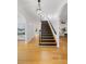 Bright foyer showcasing beautiful hardwood floors, staircase, and an open layout leading to living spaces at 669 Palisades Dr, Mount Pleasant, SC 29464