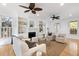 Inviting living room with hardwood floors, built-in bookshelves, fireplace, and ample seating for relaxation at 669 Palisades Dr, Mount Pleasant, SC 29464