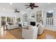 Bright, open living room features hardwood floors, built-in bookshelves, and a cozy fireplace at 669 Palisades Dr, Mount Pleasant, SC 29464
