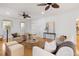 Comfortable living room featuring hardwood floors, neutral tones, and large windows allowing for abundant natural light at 669 Palisades Dr, Mount Pleasant, SC 29464