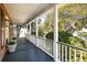 Spacious porch with dark-stained wood flooring and white columns providing an outdoor retreat at 669 Palisades Dr, Mount Pleasant, SC 29464