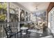 Screened porch featuring ample seating, lovely lighting, and gorgeous natural views at 669 Palisades Dr, Mount Pleasant, SC 29464