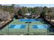 Community tennis and pickleball courts in a wooded setting offer residents a place to enjoy active recreation and sports at 669 Palisades Dr, Mount Pleasant, SC 29464