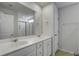 Bright bathroom featuring double sink vanity, and a shower with glass doors at 762 Redbud Ln, Summerville, SC 29486